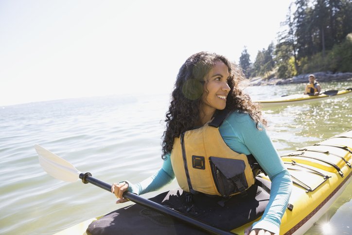 Woman Kayaking in Lake