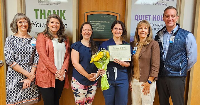 Barton leadership celebrates with DAISY Award winner, Sarah Balasanian, RN. Pictured from left to ri