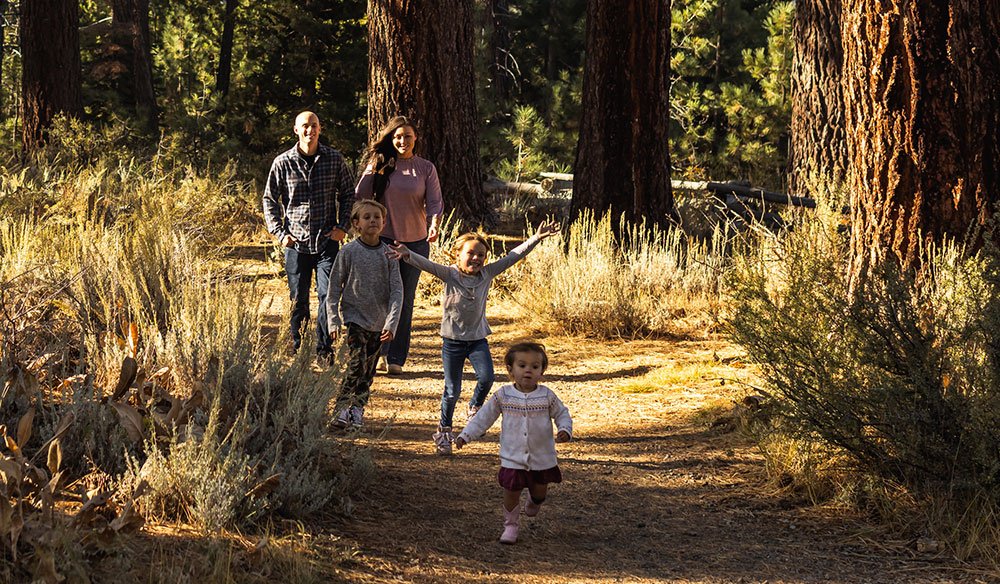 Family walking in forest in Lake Tahoe.